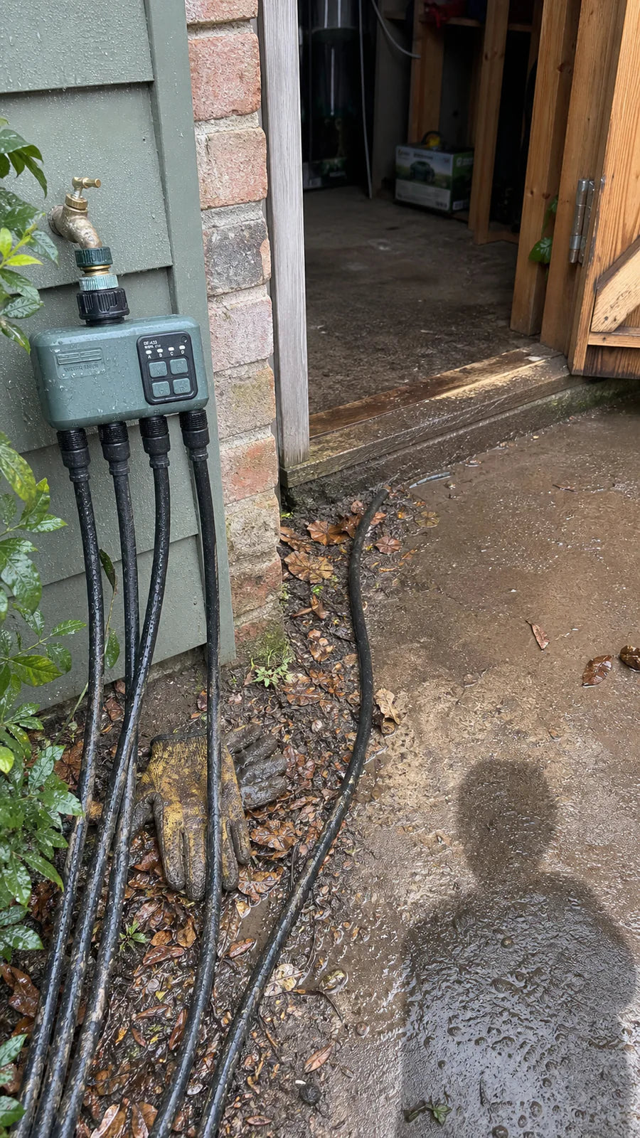 Johgee water timer in a shed door install garden scene